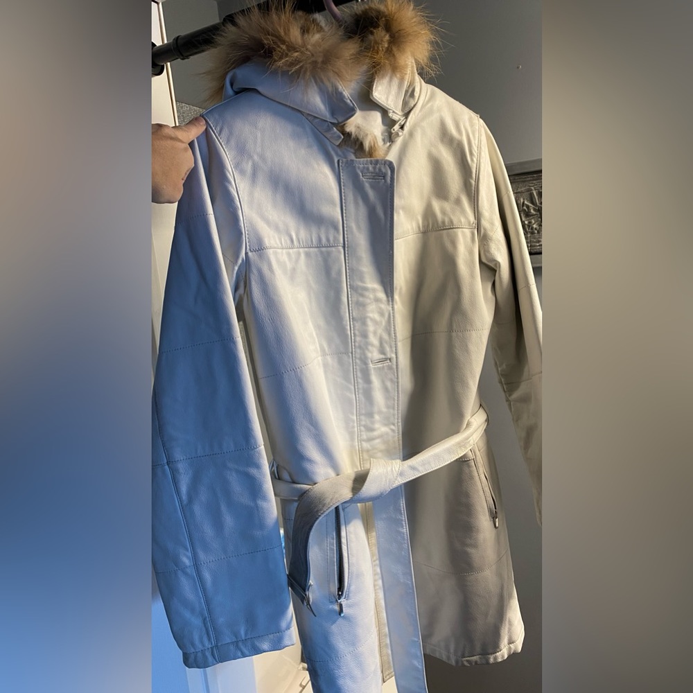 White Danier leather coat with rabbit fur inside.